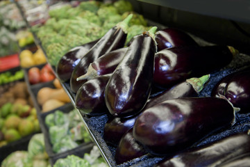 Shop vegetable department with aubergines