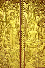 Carved door on legend of Buddha