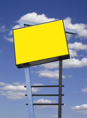 Store advertising sign in yellow over cloudy sky, isolated