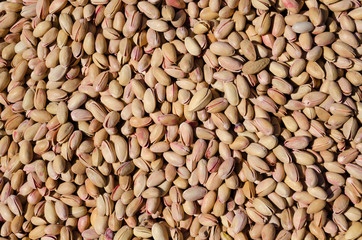 Bunch of salted roasted pistachios with salt