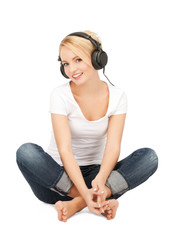 happy teenage girl in big headphones