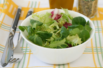 salad in a bowl with oil and herbs