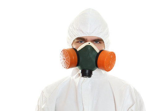 Man in protective suit, a mask and a respirator. Isolated