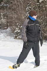 Fototapeta na wymiar mature man with snowshoes