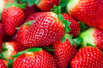 background of red big juicy ripe strawberries