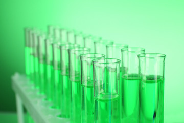Test-tubes on green background