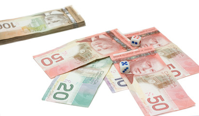 Obraz na płótnie Canvas Canadian dollars with dice
