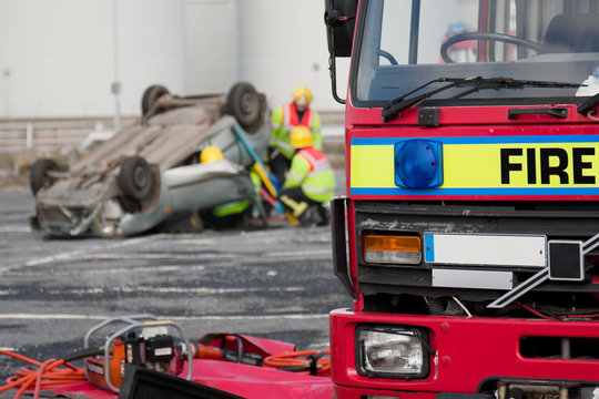 Fire and Rescue service staff at car crash