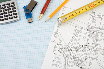 pen, pencil and memory flash on drafting