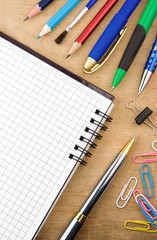 school accessories and checked notebook