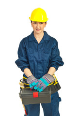 Worker woman holding tools container
