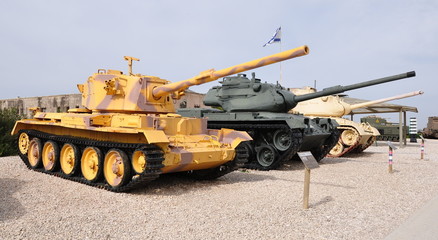 Battle tanks of different colors in Yad LaShiryon - Latrun tank museum. Central Israel.