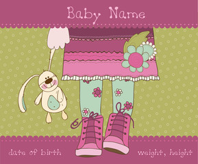 Baby girl arrival announcement card with plush rabbit