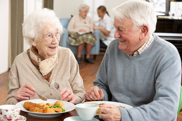 Senior Couple Enjoying Meal Together - obrazy, fototapety, plakaty