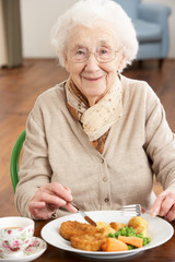 Senior Woman Enjoying Meal