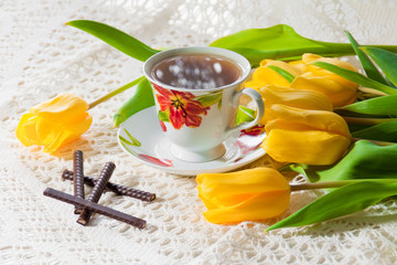 morning cup of tea with yellow tulips