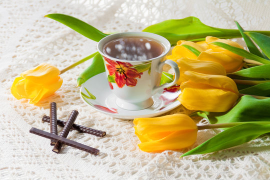 morning cup of tea with yellow tulips