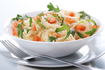 Pasta with tomato and rucola