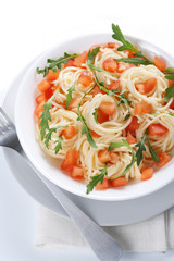 Pasta with tomato and rucola