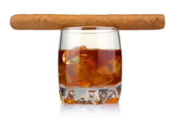 Glass of whiskey with ice cubes and havana cigar isolated