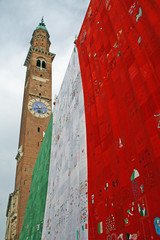 bell tower in Piazza dei Signori Vicenza with Italian flag