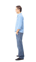 Young man standing with hands in pockets