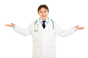 Pleased medical doctor presenting something on empty hands