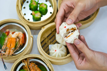Steamed dumpling with hand