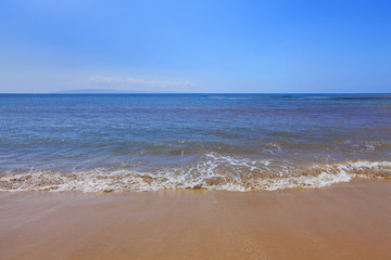 Water and sandy empty beach