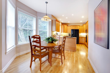 Dining area dn kitchen with maple oak wood and grey walls