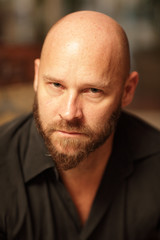 Fototapeta premium Portrait of a handsome bald man
