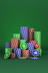 Poker background with poker chips over green background