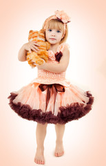 Portrait of the beautiful girl in a pink dress