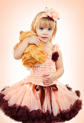 Portrait of the beautiful girl in a pink dress