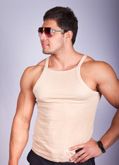 Young fashion man model with athletic body