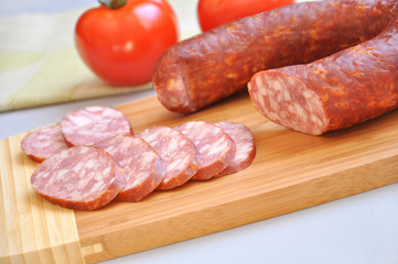 Mouth-watering smoked sausage and ripe tomatoes