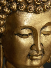 visage doré de Bouddha