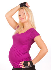 Studio portrait of  happy  pregnant woman