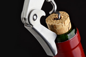 Cork-screw open wine bottle
