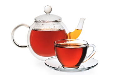 Teapot and cup with black tea on a whire background