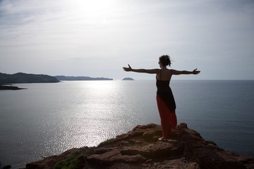 Fototapeta na wymiar woman over Menorca north coastline