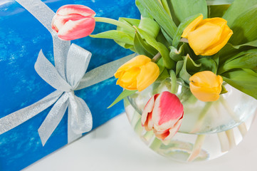 Bouquet of tulips and gift
