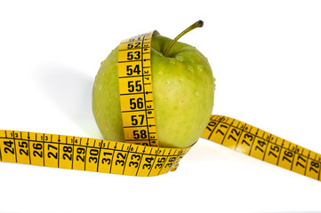 green apple and measurement tape