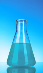 Conical flask on blue background