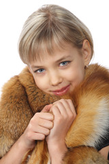 Beautiful young blond girl in fur