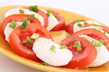 Caprese salad - tomatoes, mozzarella and parsley