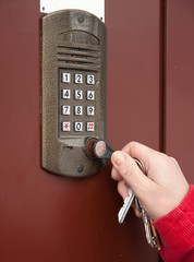 Hand with keys near intercom