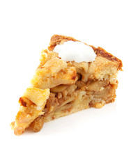 Piece of apple pie with whipped cream over white background