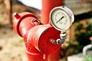 Red fire hydrant on a sidewalk