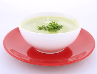 Pea and mozzarella soup decorated with some cress